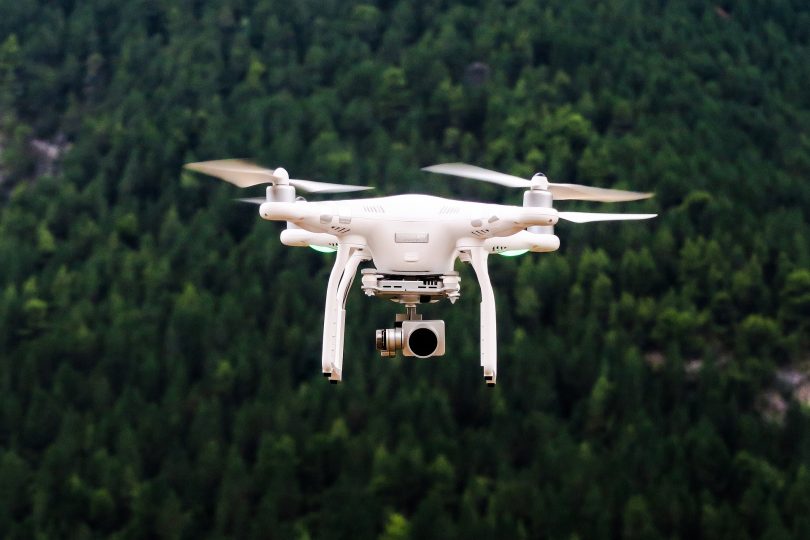 how low can you fly a drone over private property