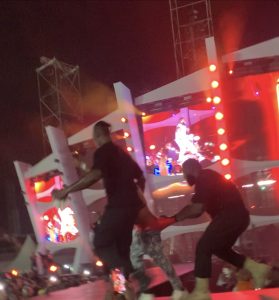 Moments an overzealous Davido fan was dragged pants down on stage at a Timeless event